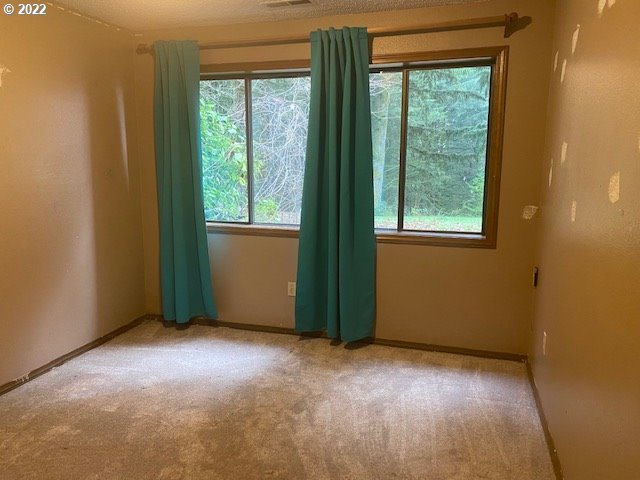 7705 Northeast Quarry Road La Center, WA 98629 - Photo 23 of 27 an empty room with a window