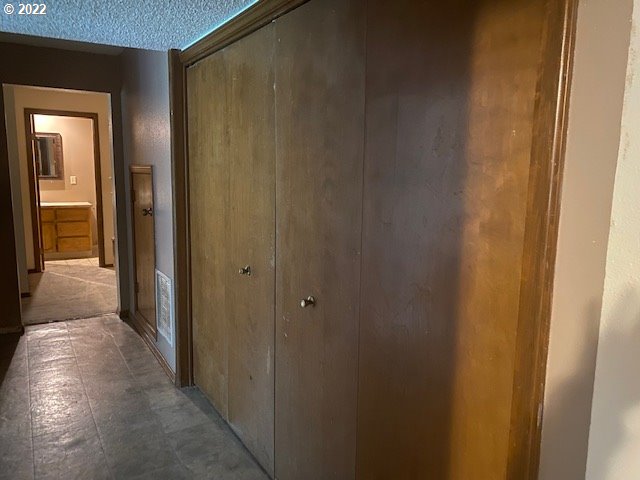 7705 Northeast Quarry Road La Center, WA 98629 - Photo 24 of 27 a view of a hallway with a wooden door