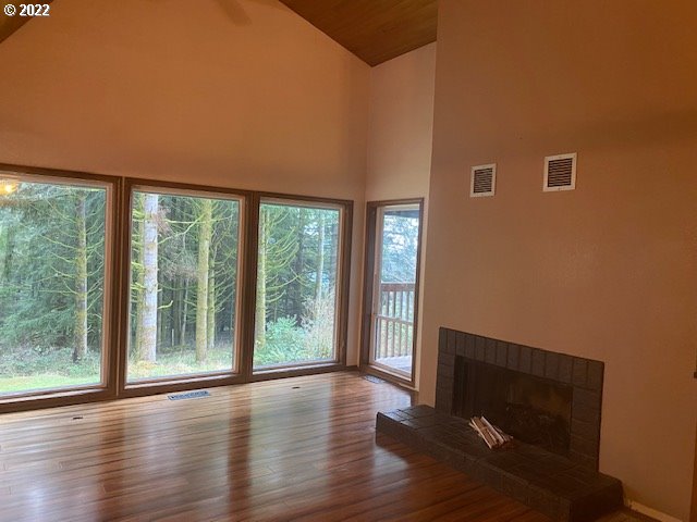7705 Northeast Quarry Road La Center, WA 98629 - Photo 4 of 27 a view of hallway with wooden floor and front door