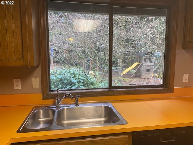 7705 Northeast Quarry Road La Center, WA 98629 - Photo 6 of 27 a view of a sink and table in a kitchen