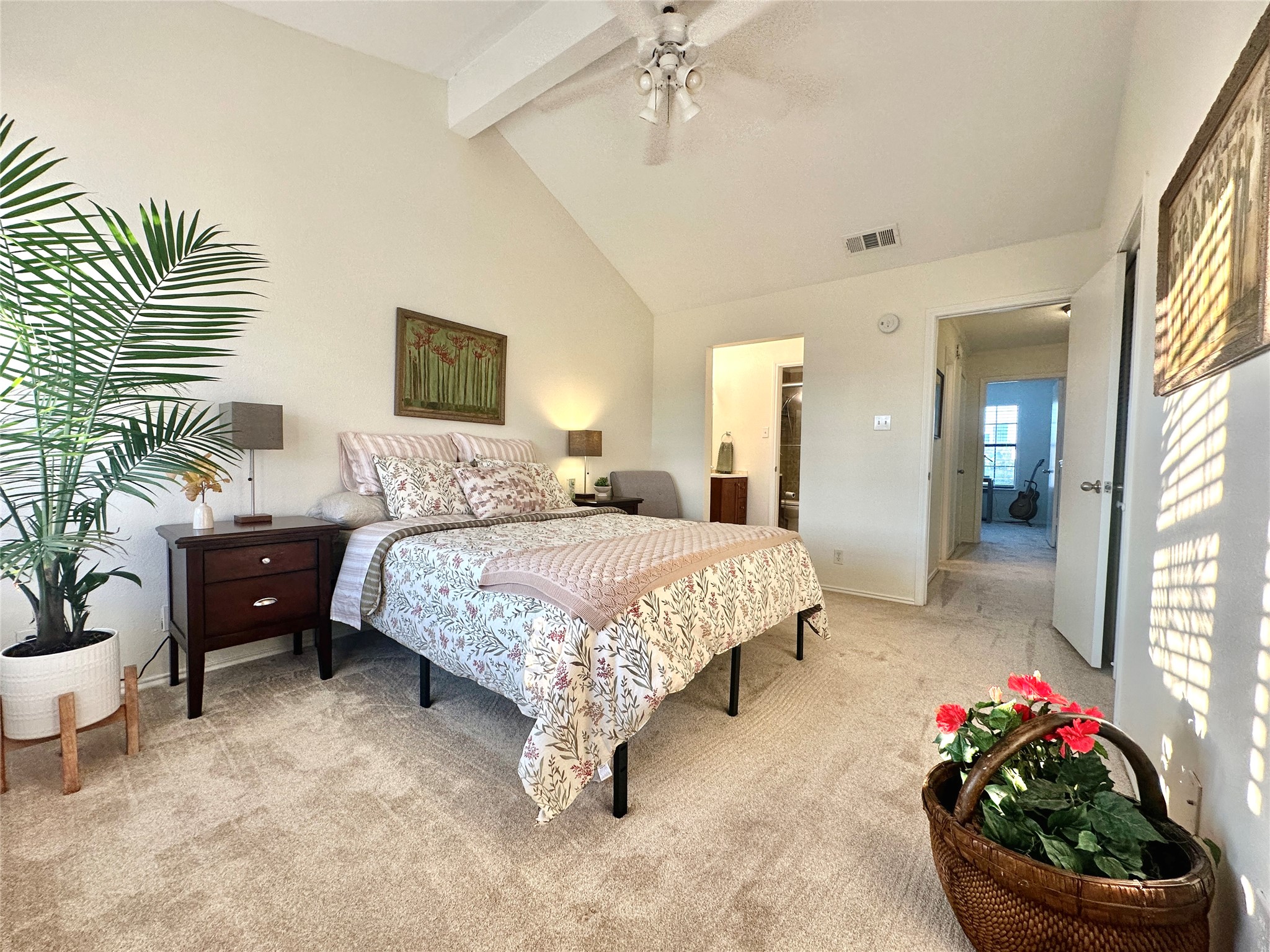 2215 Post Road, Unit 2055 Austin, TX 78704 - Photo 12 of 30 Vaulted ceilings and plush carpeting create a relaxing atmosphere in this primary bedroom retreat.