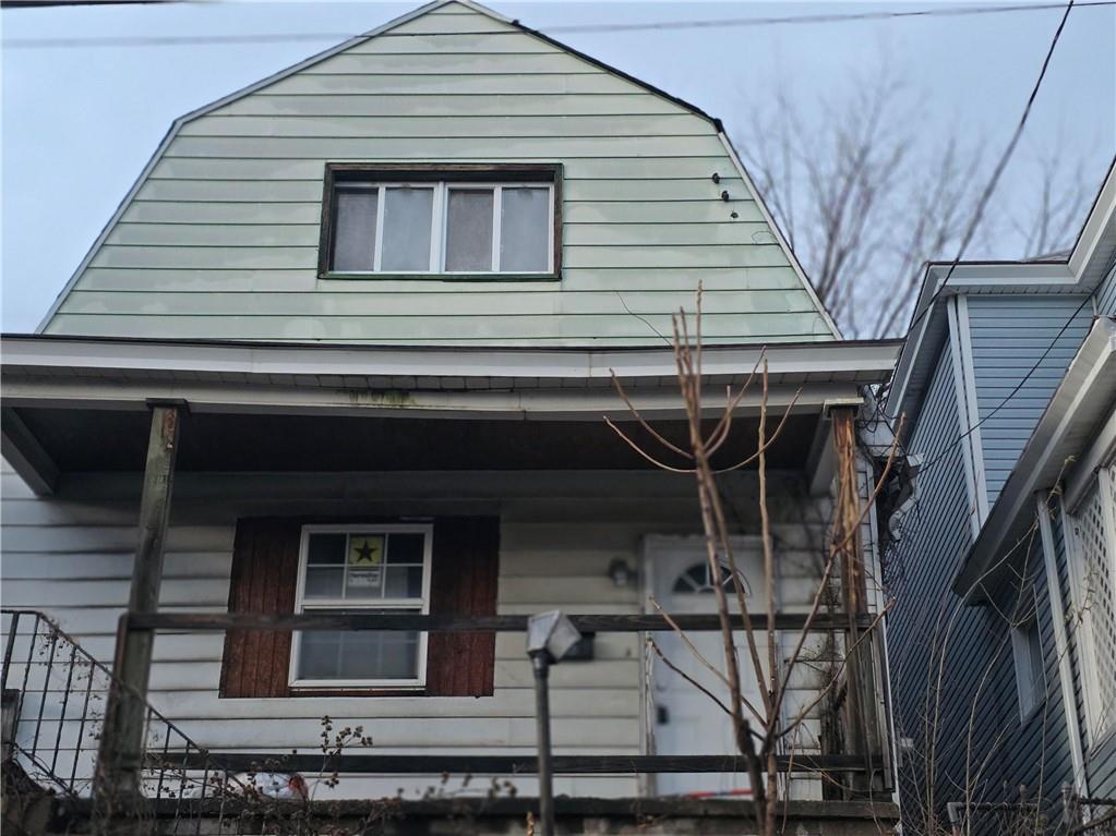 a front view of a house with parking space