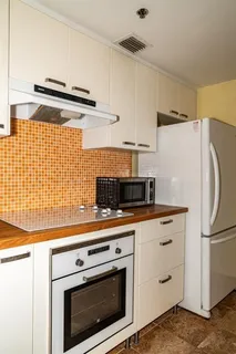 a kitchen with stainless steel appliances a stove and a refrigerator