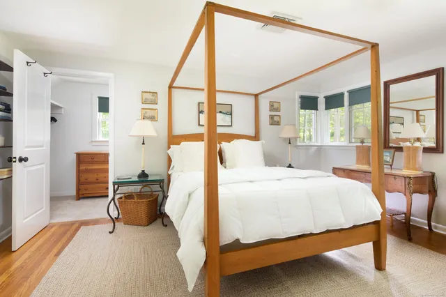 a view of a house with yard and a garden