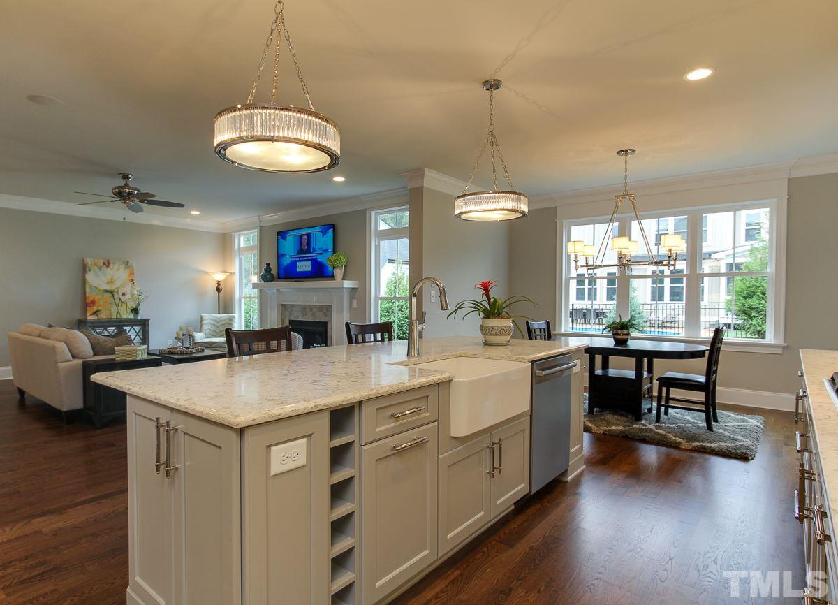 8809 Breeland Way Raleigh, NC 27613 - Photo 8 of 25 a large kitchen with a table and chairs