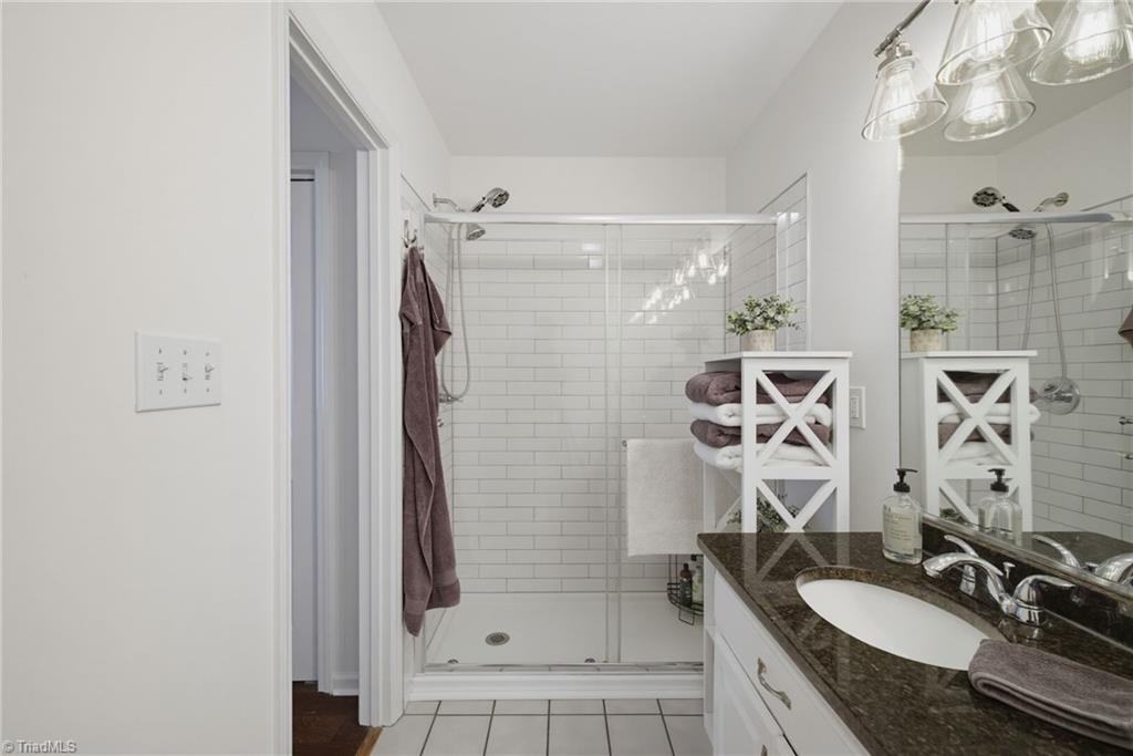 2800 Spencers Grove Road Browns Summit, NC 27214 - Photo 28 of 49 Beautiful tiled shower in primary bathroom.