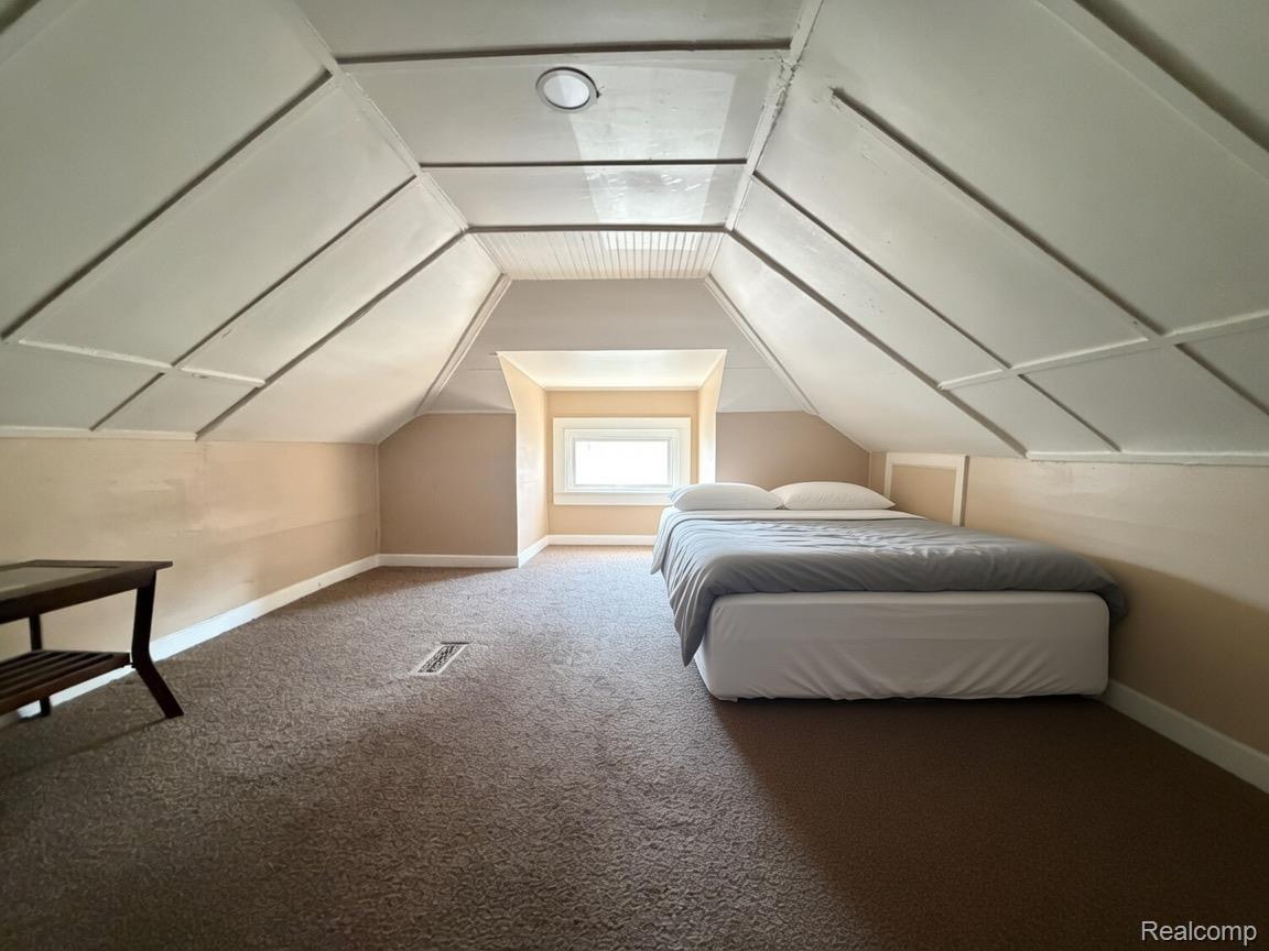 9940 Manor Detroit, MI 48204 - Photo 15 of 16 Carpeted room with sloped ceilings and recessed lighting