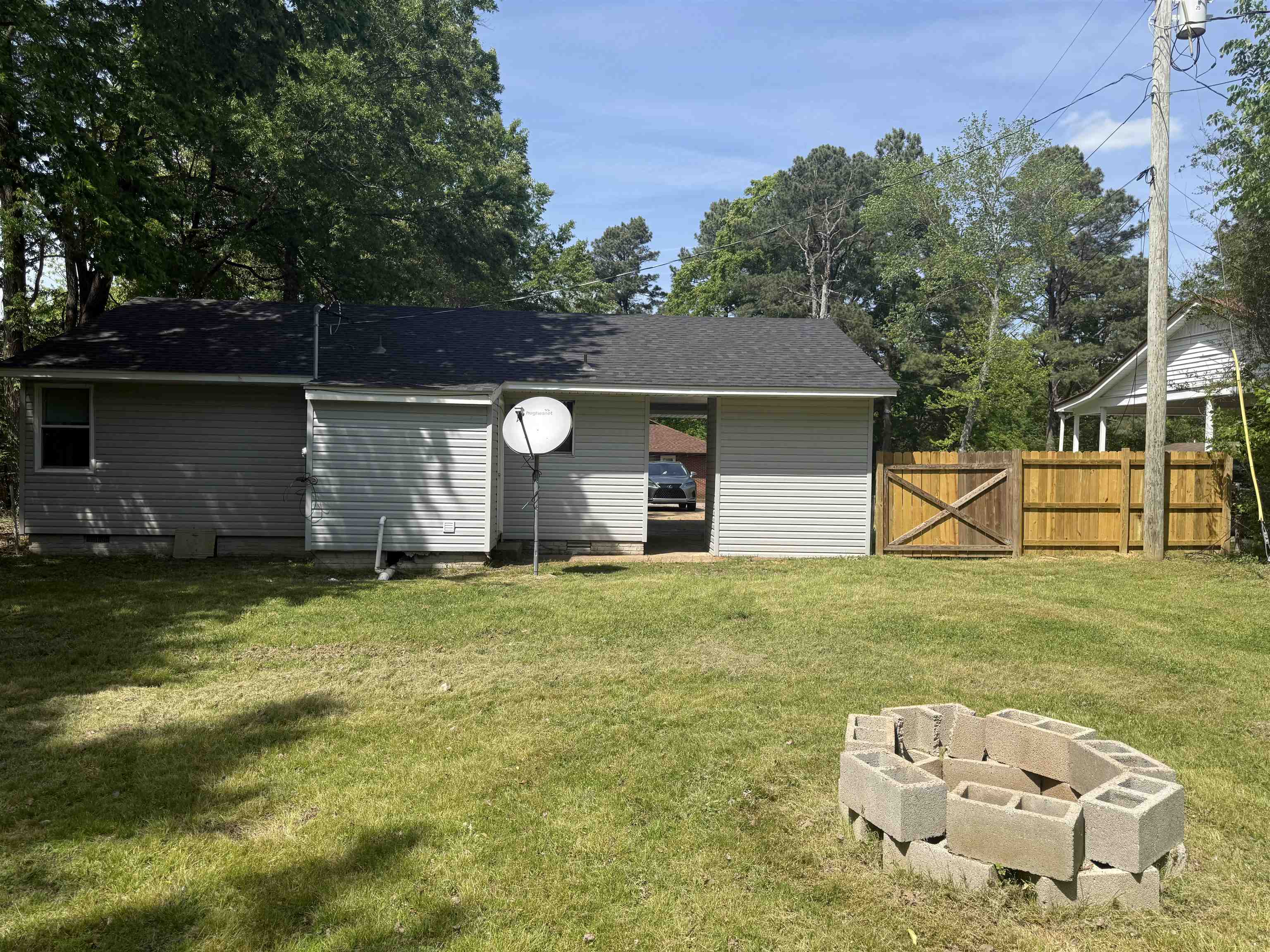 112 Tapp Drive Somerville, TN 38068 - Photo 16 of 16 a backyard of a house with table and chairs
