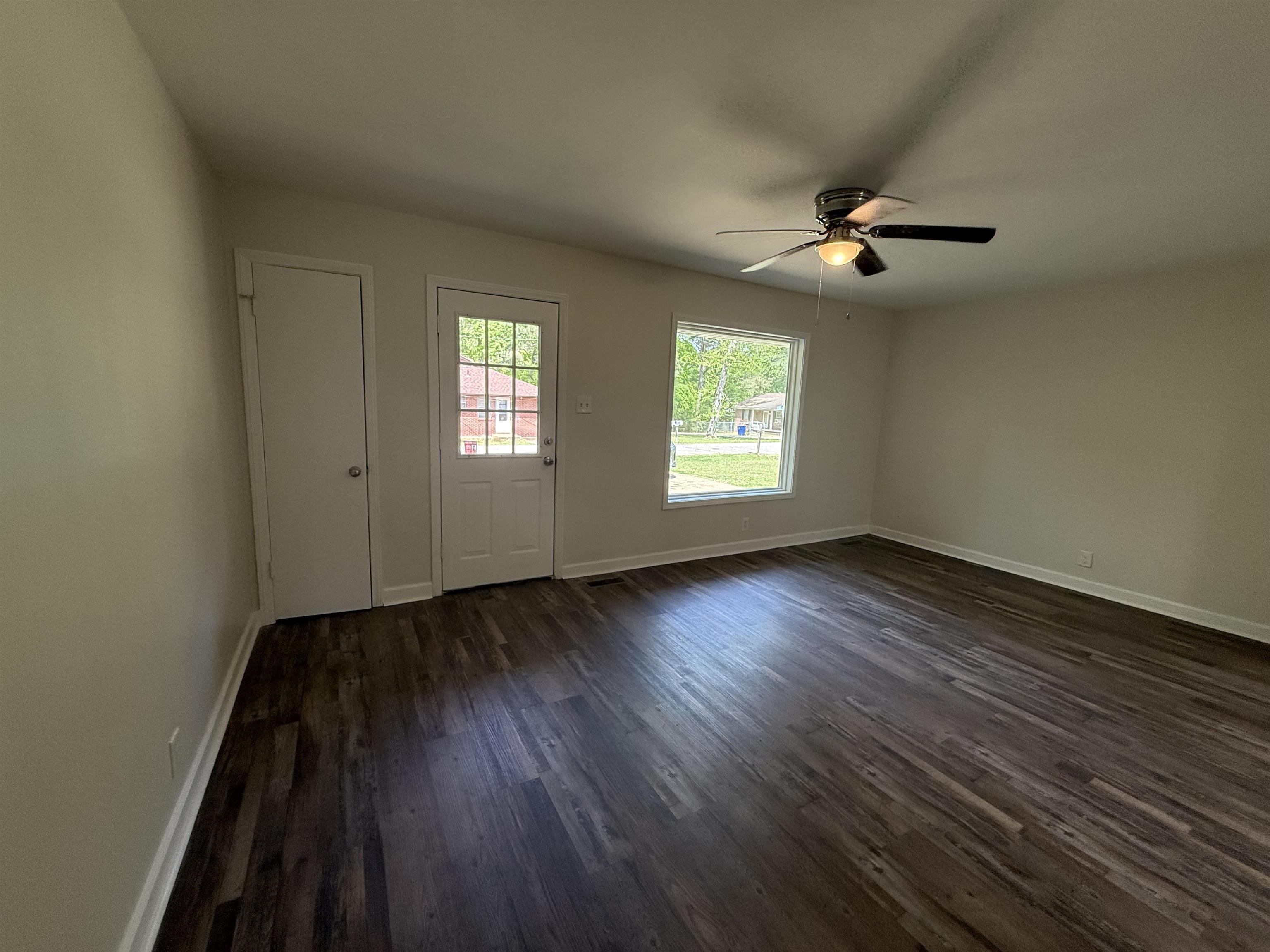 112 Tapp Drive Somerville, TN 38068 - Photo 3 of 16 wooden floor in an empty room with a window