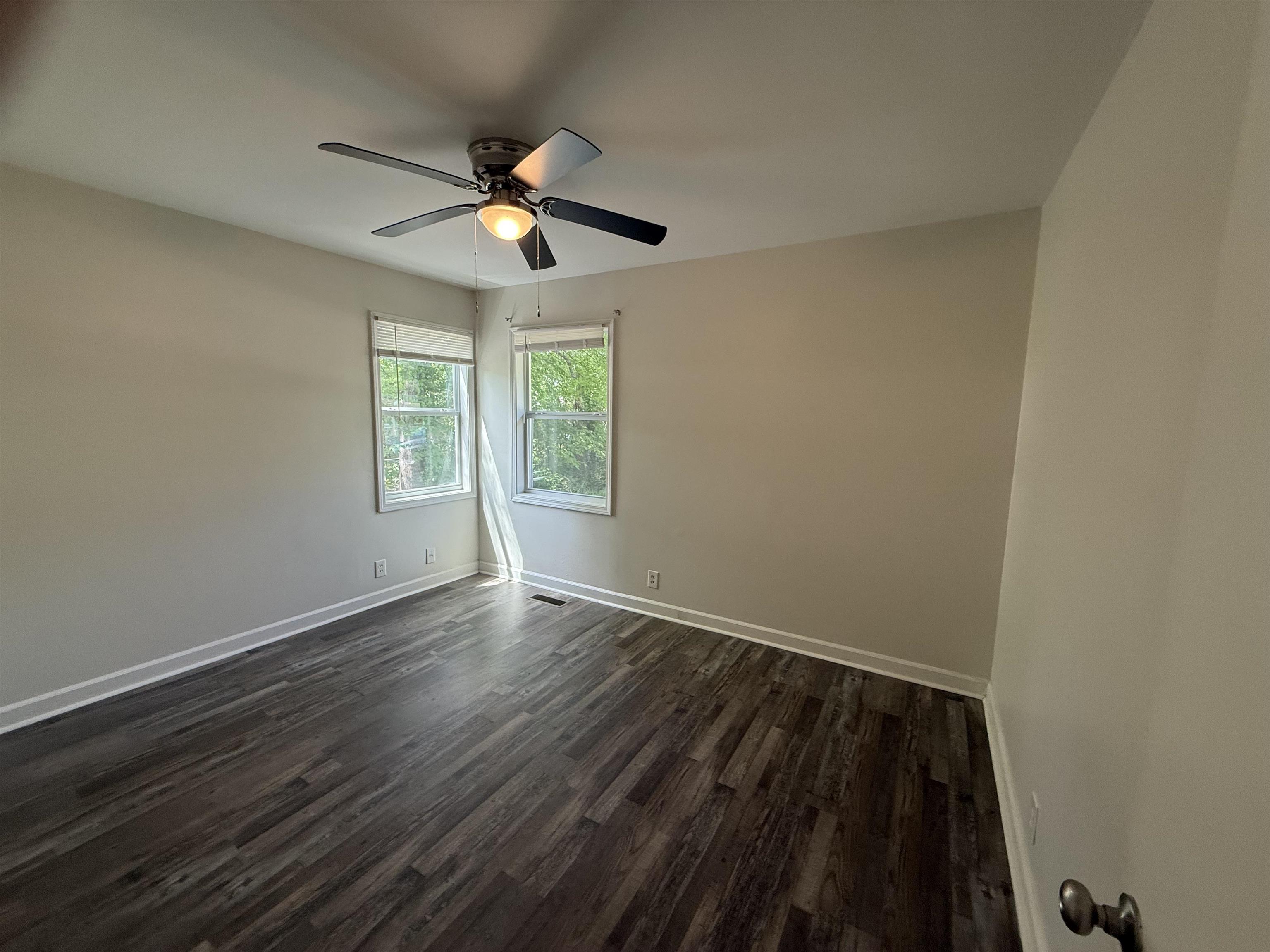 112 Tapp Drive Somerville, TN 38068 - Photo 9 of 16 a view of an empty room with wooden floor and a window