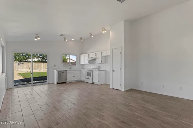 a view of a kitchen with furniture and windows
