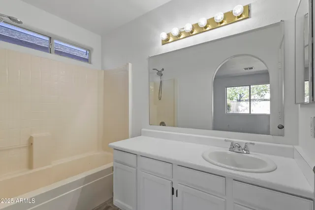 a bathroom with a sink and a bathtub
