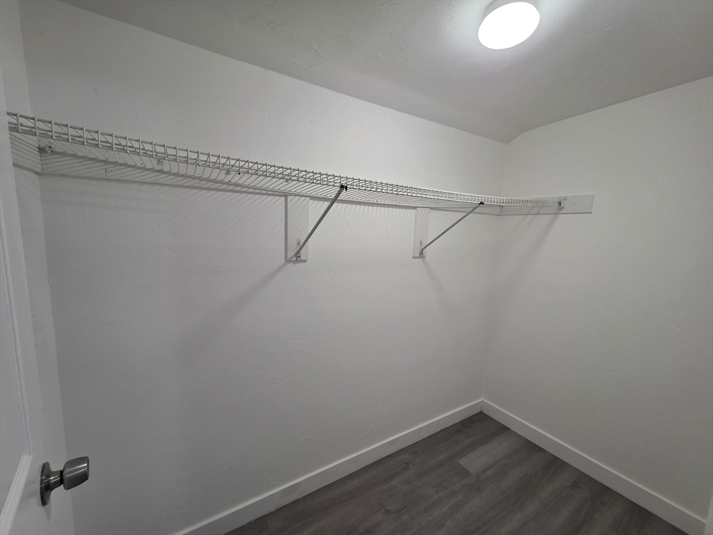 39 Harlem Street, Unit 3 Worcester, MA 01610 - Photo 11 of 18 a view of a room with racks on the wall