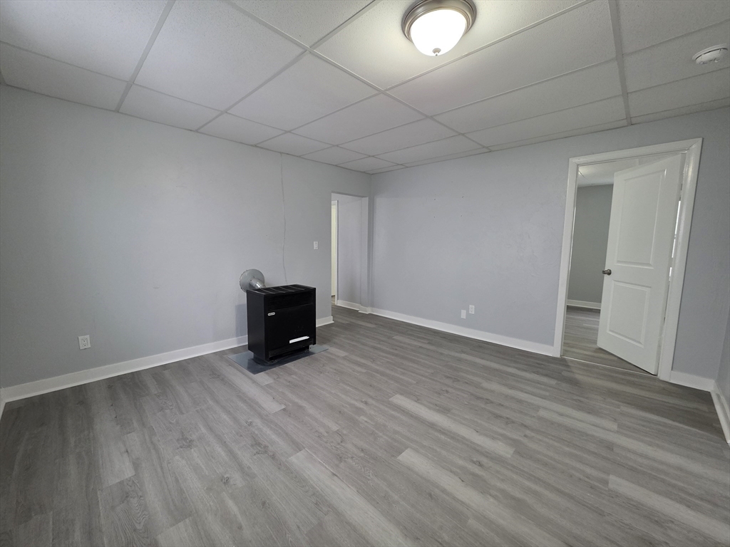 39 Harlem Street, Unit 3 Worcester, MA 01610 - Photo 15 of 18 a view of empty room with wooden floor