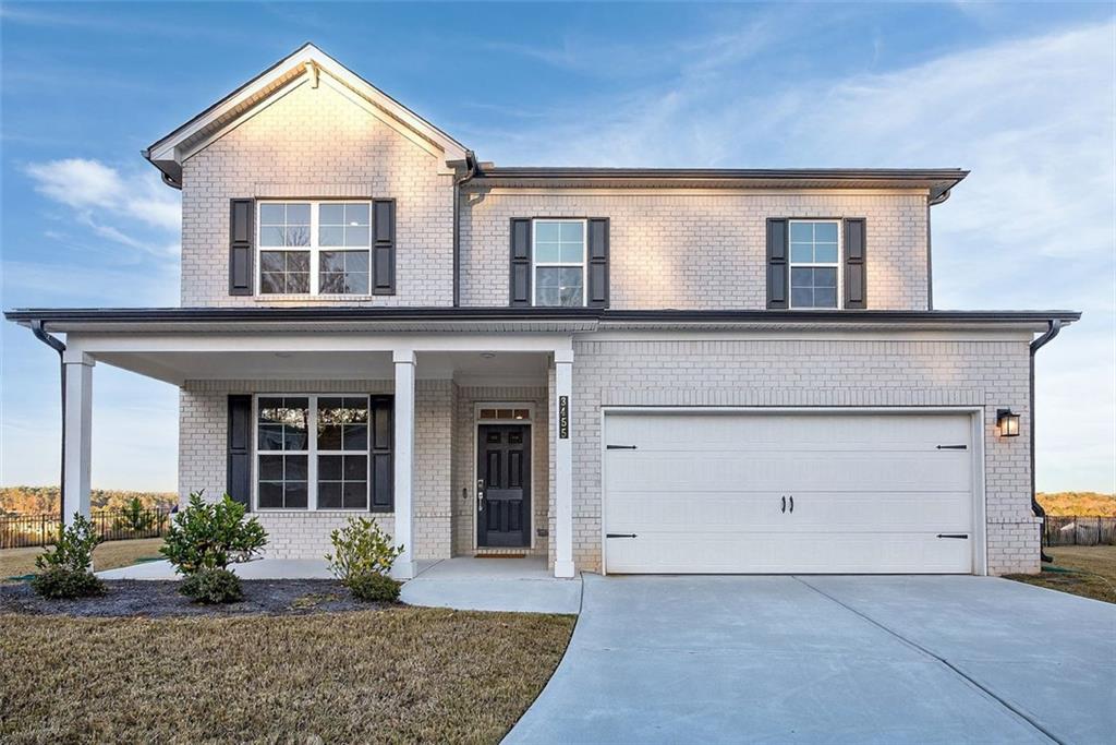 a view of house with yard