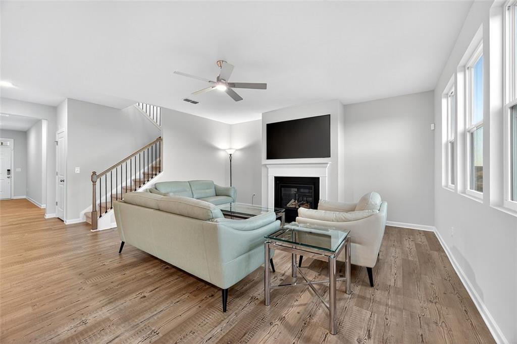 3455 Jasmine Way Atlanta, GA 30331 - Photo 12 of 46 a living room with furniture a fireplace and a flat screen tv