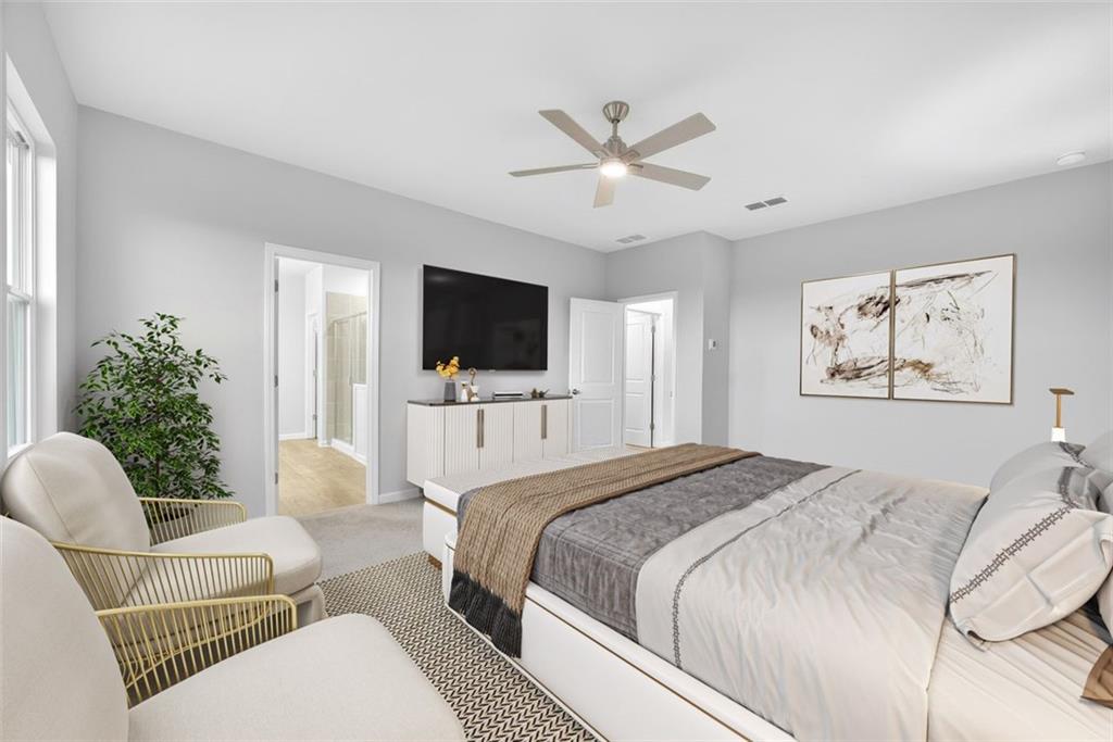 3455 Jasmine Way Atlanta, GA 30331 - Photo 17 of 46 a spacious bedroom with a bed and a flat screen tv