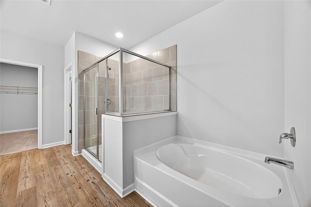 3455 Jasmine Way Atlanta, GA 30331 - Photo 19 of 46 a bathroom with a bathtub and a shower