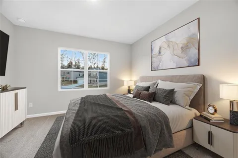 a bedroom with bed and a window