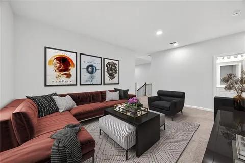 a living room with furniture rug and couch