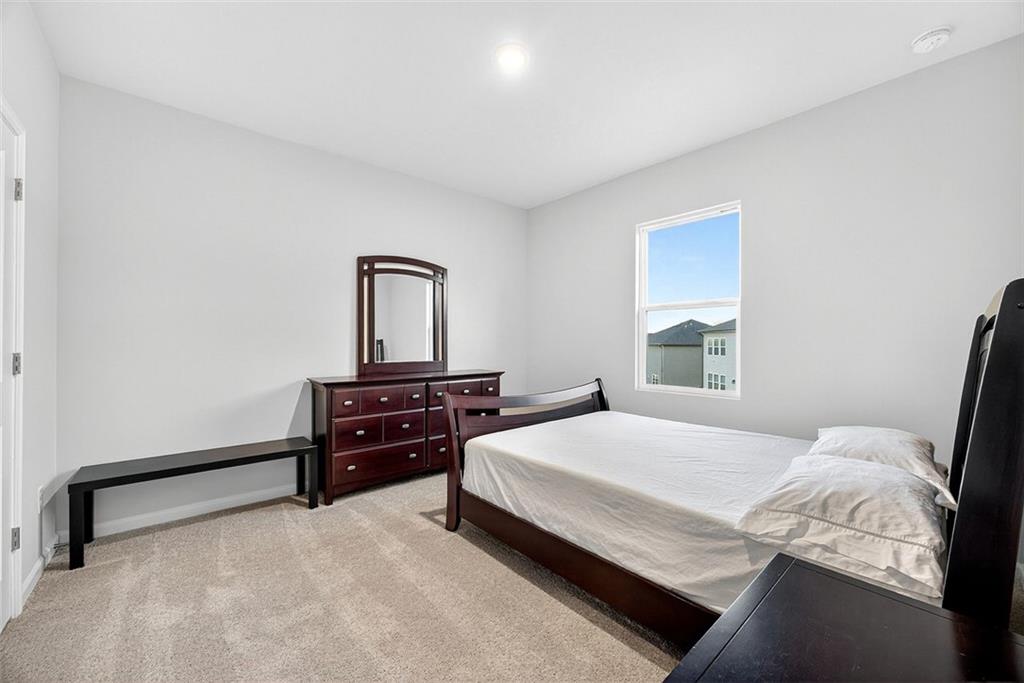 3455 Jasmine Way Atlanta, GA 30331 - Photo 31 of 46 a bedroom with a bed and a dresser