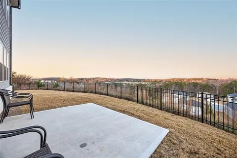 a view of a backyard with sitting area