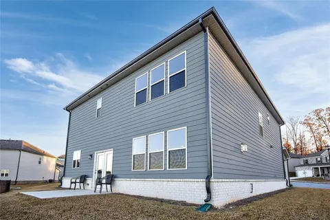 a view of a house with a street
