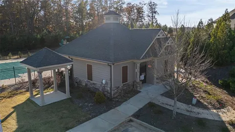 a view of a house with a backyard