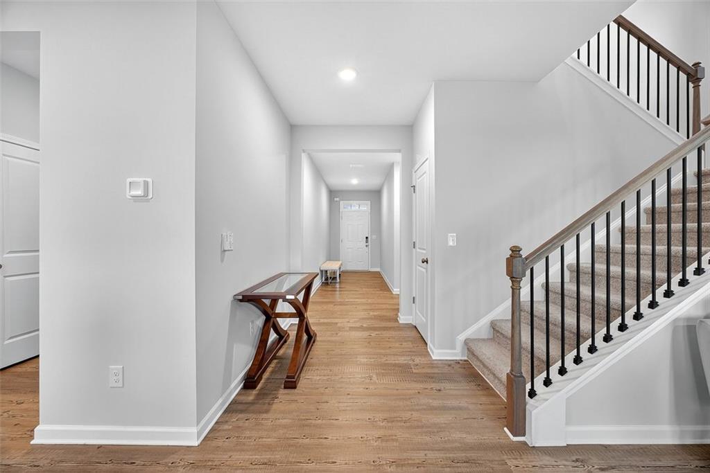 3455 Jasmine Way Atlanta, GA 30331 - Photo 5 of 46 a view of a hallway with the wooden floor and staircase