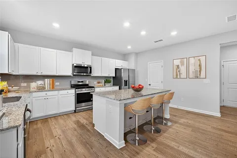 a kitchen with a sink a counter top space and appliances