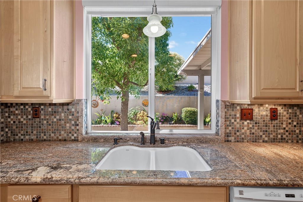 5001 Rio Bravo Drive Banning, CA 92220 - Photo 22 of 38 Looking out to the backyard from the kitchen window
