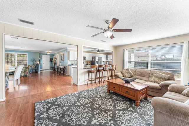a living room with furniture and a table
