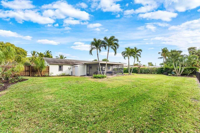 a front view of house with yard and seating