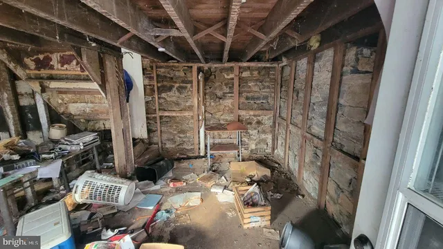 a bathroom with a shower and a sink