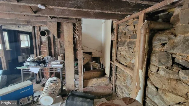 a view of a livingroom with furniture and a window
