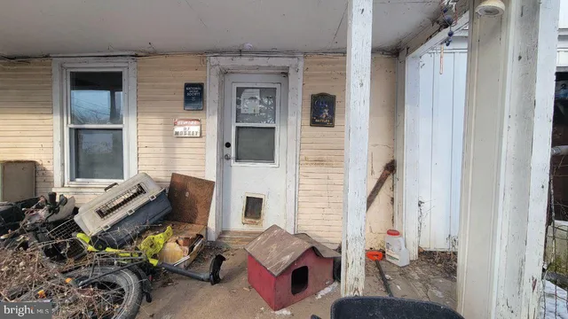 a view of living room filled with furniture and a window