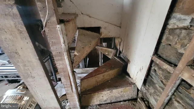 a view of a livingroom with furniture and a window