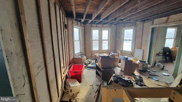 a bedroom with furniture and a window