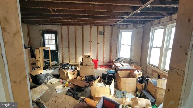 a view of a livingroom with furniture and windows