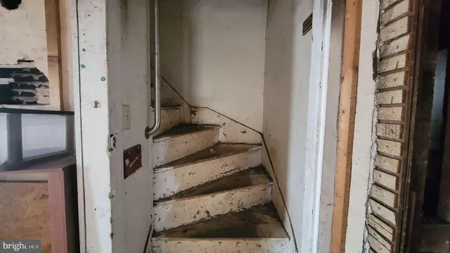 a room with furniture and a wooden floor