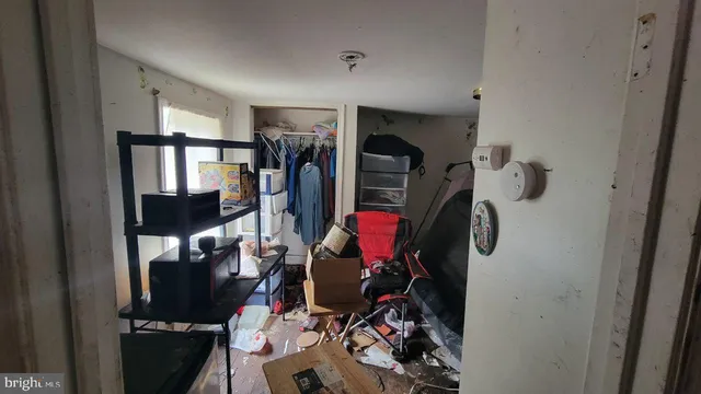 a room with chairs and closet