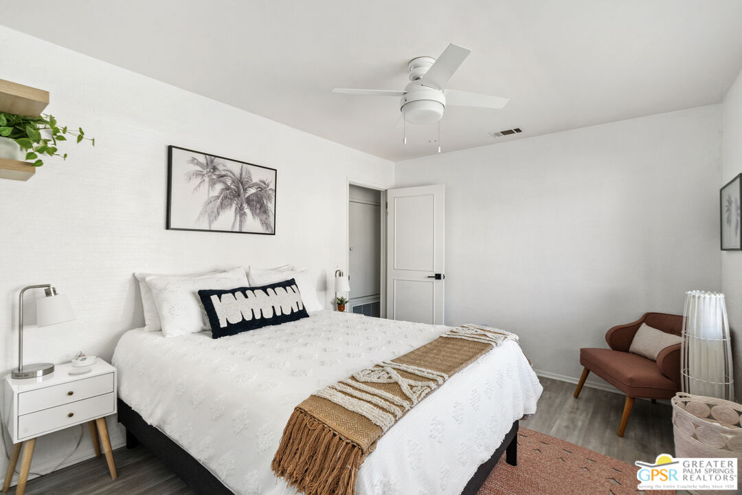 2493 East Powell Road Palm Springs, CA 92262 - Photo 12 of 43 a bedroom with bed and a chair