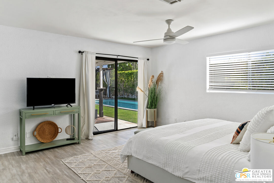2493 East Powell Road Palm Springs, CA 92262 - Photo 15 of 43 a bedroom with a bed and a television