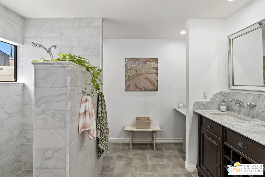 2493 East Powell Road Palm Springs, CA 92262 - Photo 17 of 43 a bathroom with a sink and a mirror