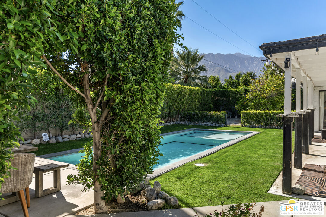 2493 East Powell Road Palm Springs, CA 92262 - Photo 25 of 43 a view of a backyard with a garden