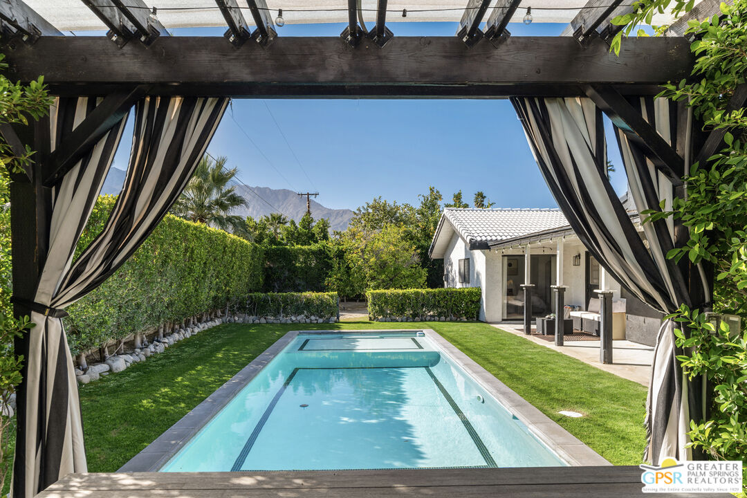 2493 East Powell Road Palm Springs, CA 92262 - Photo 26 of 43 a view of house with backyard porch and furniture