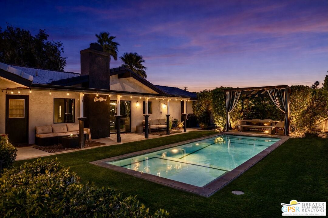 2493 East Powell Road Palm Springs, CA 92262 - Photo 30 of 43 a view of a house with swimming pool and sitting area