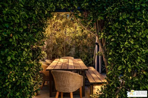 a view of a yard in a backyard