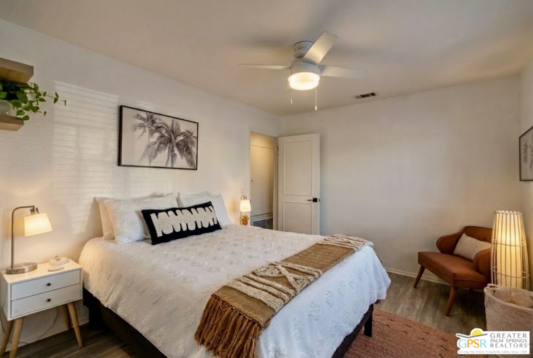 2493 East Powell Road Palm Springs, CA 92262 - Photo 38 of 43 a bedroom with a bed and a chair