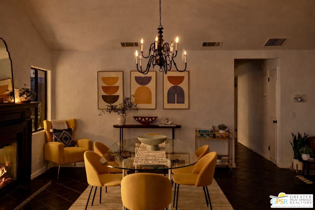 2493 East Powell Road Palm Springs, CA 92262 - Photo 39 of 43 a view of a dining room with furniture and wooden floor